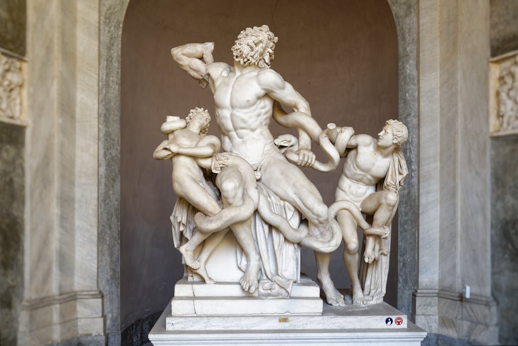 Intricate marble sculpture of Laocoön and his sons battling serpents, a masterpiece of classical art.
